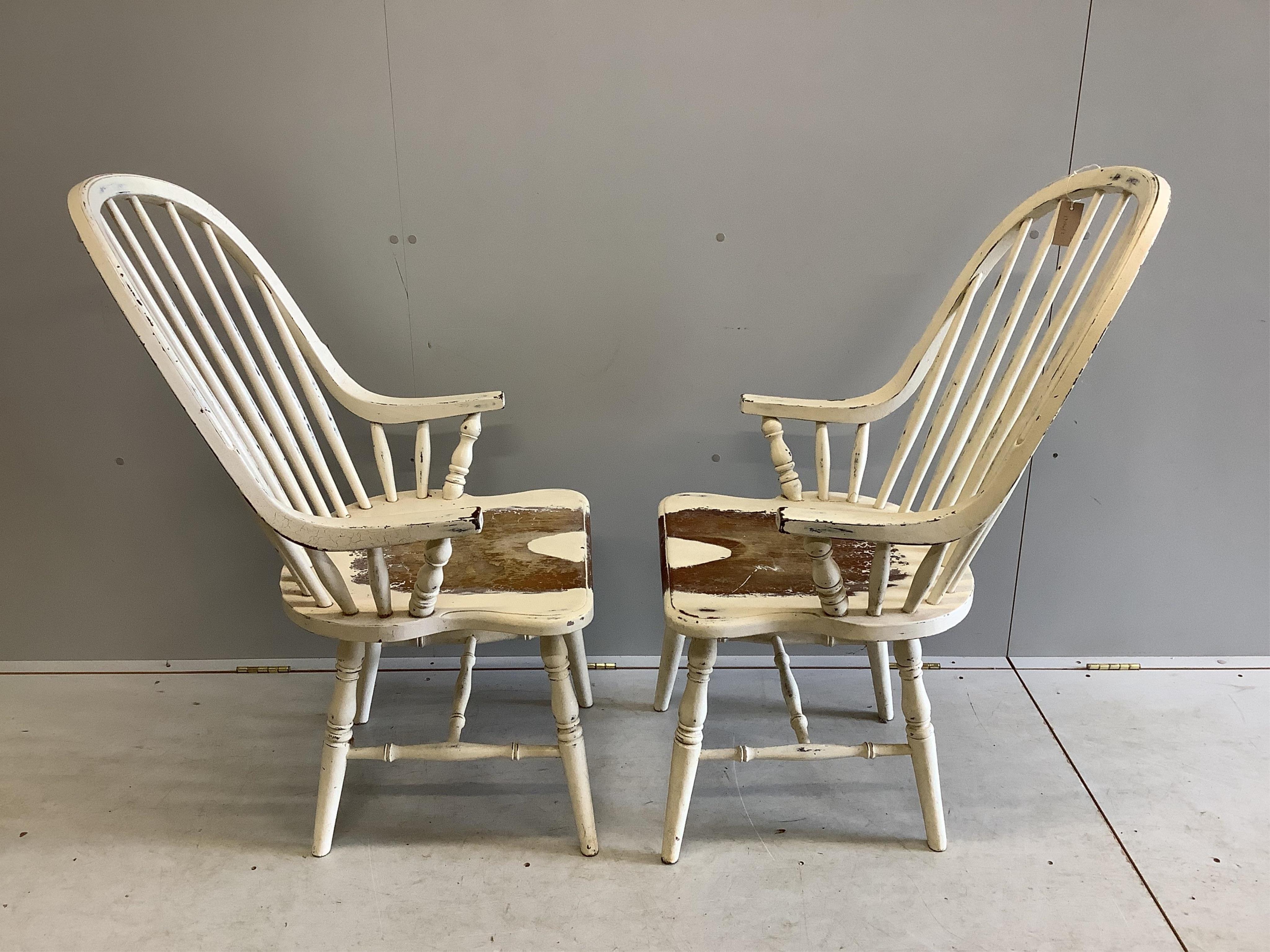 A pair of Laura Ashley painted Windsor comb back armchairs, width 59cm, depth 46cm, height 104cm. Condition - fair